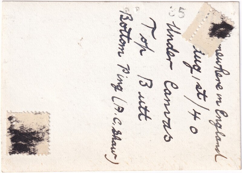 The image shows the reverse side of an aged photograph with handwritten text in black ink. The text is written in cursive and reads "Somewhere in England Aug 1st/40 Under Canvas Top Butt Bottom Ping (A.C. Shaw)