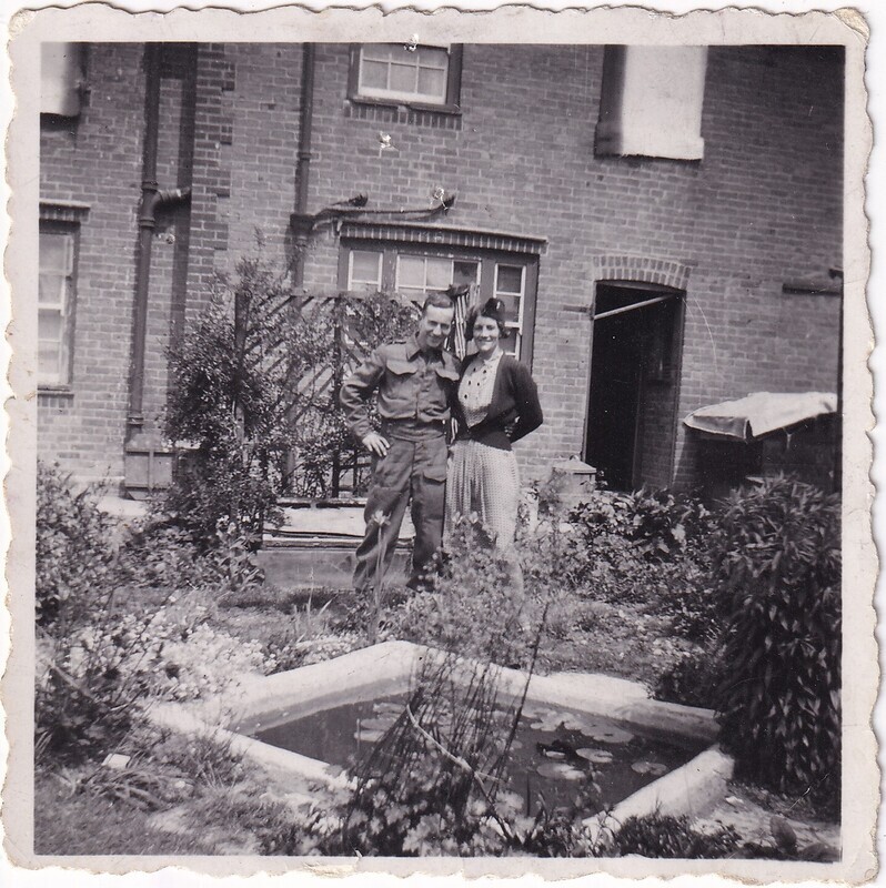 W.I. (Bill) Hann and Mrs. Packer in her garden, front