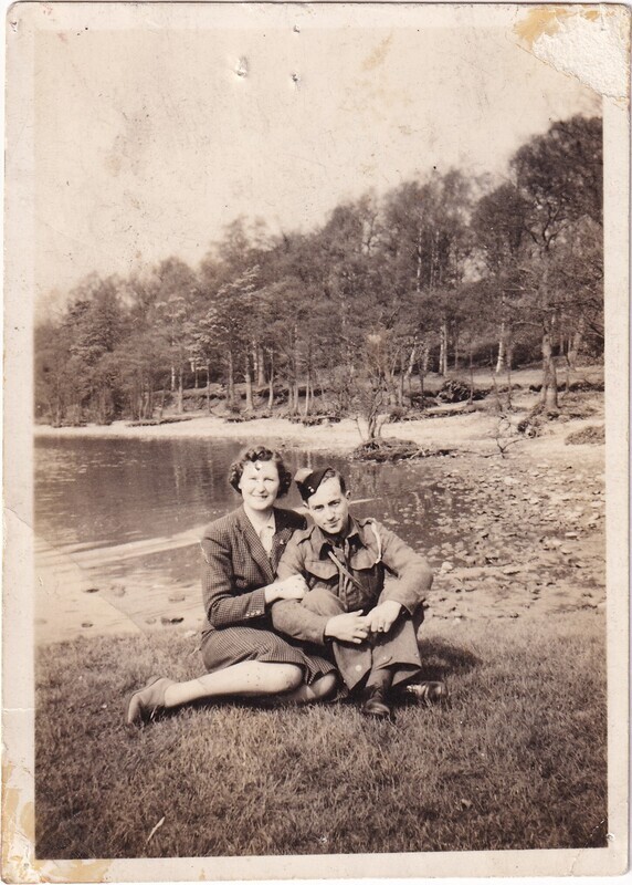 W.I. (Bill) Hann and Mary Mann sitting beside the water, front