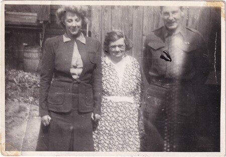 A photo of Frank Squires of Bell Island, his English wife [Edith], and an unidentified woman