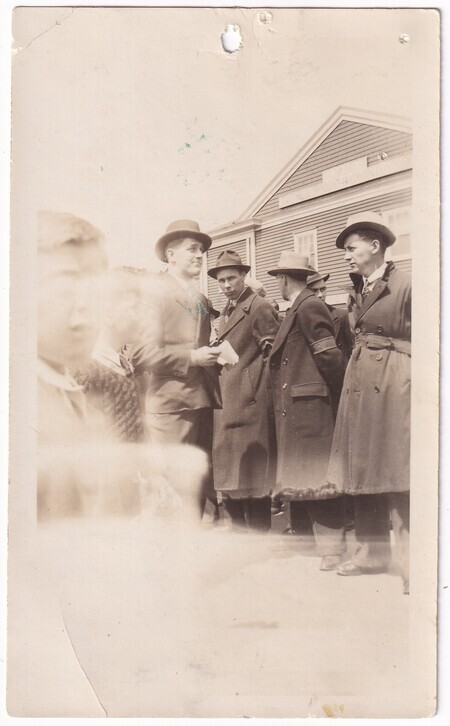 A photo of a group of Corner Brook volunteers, with a child in the foreground, waiting to depart by train for Port aux Basques