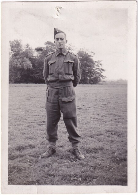 A photo of W.I. (Bill) Hann standing in a field wearing his army uniform taken in [East Anglia] England