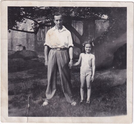 A photo of W.I. (Bill) Hann wearing civilian clothes with Adelaide Lilian (née Ditchburn) Packer's daughter in Cambridge, England