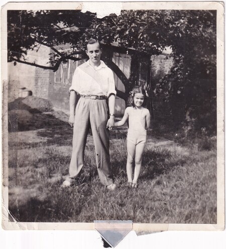 A photo of W.I. (Bill) Hann wearing civilian clothes with Adelaide Lilian (née Ditchburn) Packer's daughter in Cambridge, England