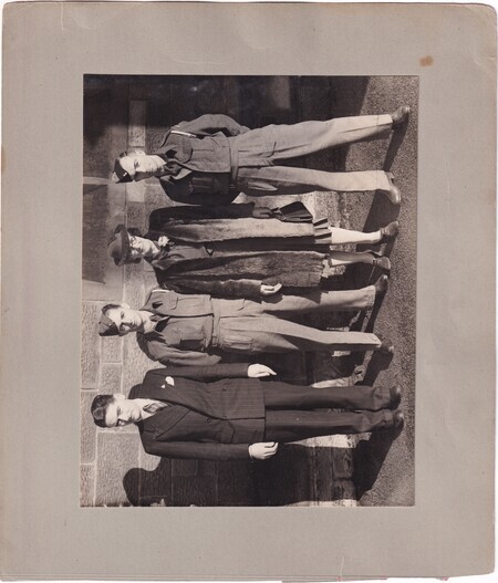 A photo of George Black, Victor Hann, Jean Edmunds (née Mann), and W.I. (Bill) Hann taken at the wedding of W.I. (Bill) and Mary (née Mann) Hann at the New Kilpatrick Parish Church in Glasgow, Scotland