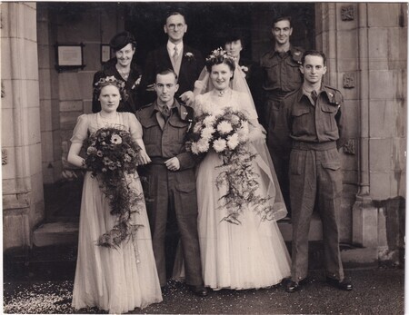 A photo of (front row) Marion Mann, W.I. (Bill) Hann, Mary Hann (née Mann), Victor Hann, (back row) Elsie ... (née Hann), John Mann, Marion Mann (née Provan), and Harold Hann taken at the wedding of W.I. (Bill) and Mary (née Mann) Hann at the New Kilpatrick Parish Church in Glasgow, Scotland