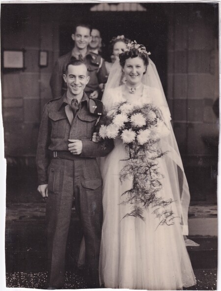 A photo of W.I. (Bill) and Mary (née Mann) Hann, with Victor Hann, Marion (née Mann), and John Mann in the background, taken at their wedding at the New Kilpatrick Parish Church in Glasgow, Scotland