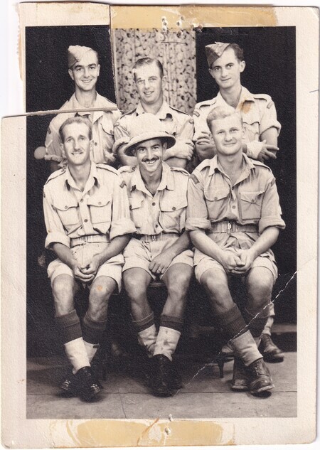 A photo of six Newfoundland soldiers including W.I. (Bill) Hann (front row, middle), Harold Hann (back row, left), and Victor Hann (back row, right) [taken in Bone, i.e., Annaba, Algeria]
