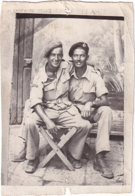 A photo of W.I. (Bill) Hann and an unidentifed [Canadian] soldier seated beside one another